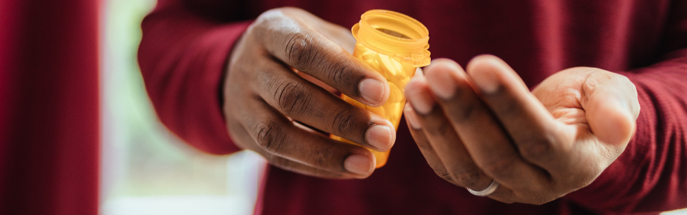 hands holding prescription bottle