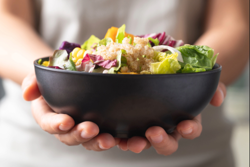 person holding bowl of food