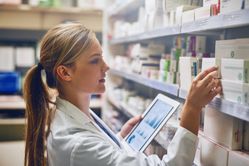 Female Pharmacist Shelves