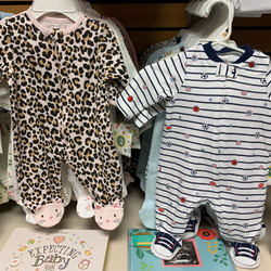 image of variety of baby onesies